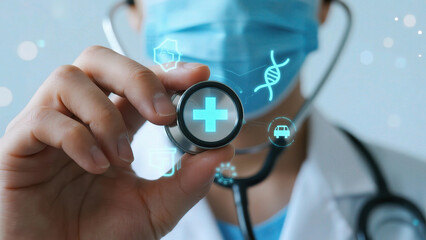 Doctor holding stethoscope with digital icons