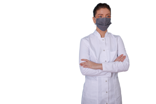 Female doctor wearing protective face mask and lab coat, standing with arms crossed, transparent background