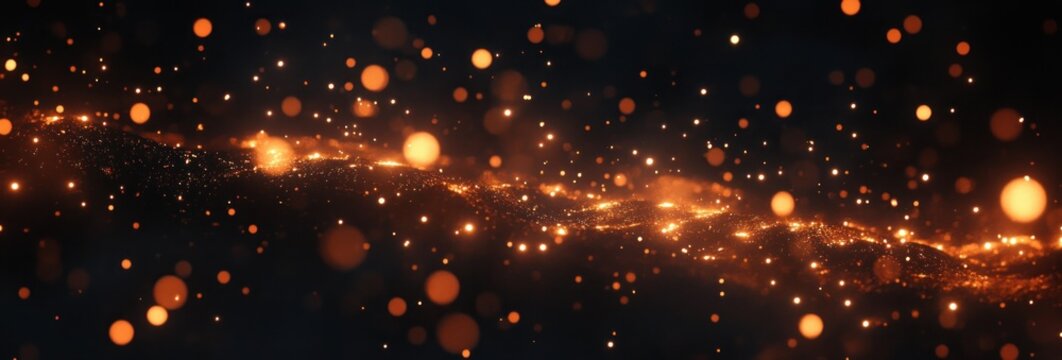 Glowing orange particles floating and swirling gently over a dark background creating a warm and magical atmosphere - Powered by Adobe