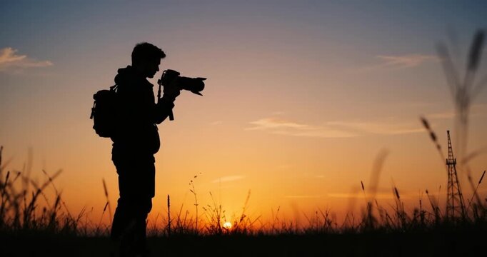 silhouette of a man with a backpack