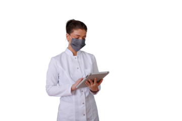 Doctor woman in lab coat wearing a protective face mask using a digital tablet for healthcare data