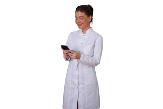Female doctor wearing lab coat and using smartphone, smiling and scrolling on social media with transparent background