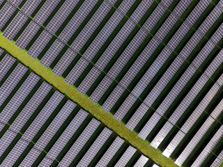 Aerial view of a solar farm producing clean renewable sun energy, industrial landscape