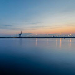Early summer morning at Malmö harbor entrance with pastel sky tones