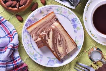 Slices of marble honey spong cake on the plate