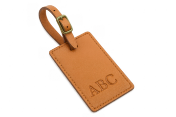 Brown leather luggage tag with monogram on transparent background