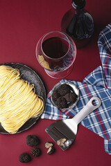 Black truffle and fresh pasta Tajarin. Magical autumn light. Autumn gourmet cuisine of Piedmont, Northern Italy, Spain and France 