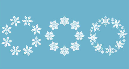 Collection of elegant white snowflake wreaths on blue background, minimalist winter decoration design set perfect for Christmas cards, holiday invitations, digital prints, and seasonal project