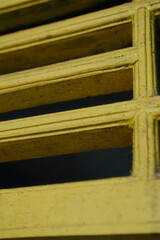 Explore the striking texture and geometric design of aged yellow metal, perfect for adding industrial charm to your next project. Abstract metal art.