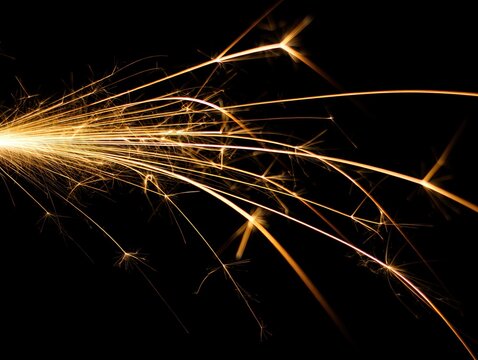 sparkler burning brightly on black background - Powered by Adobe