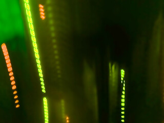 Elegant neon colored lines of light cut through the darkness of the night, giving a futuristic and dynamic impression of speed and movement, like a stunning digital abstract painting