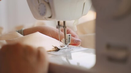 senior woman tailor sewing clothes using sewing machine, process of creating dress. Close-up hands seamstress's fabric stitching. female fashion designer work. elderly lady hobby home workshop space - Powered by Adobe