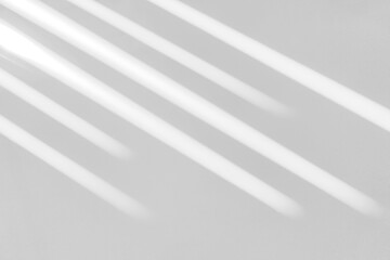 Gray shadow and light blur abstract background on white wall  from window. Dark stripe grey shadows indoor in room  background, monochrome, shadow overlay effect for backdrop and mockup design