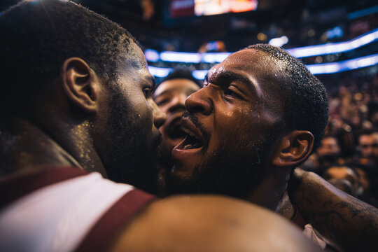 Sweaty close-up of basketball teammates embracing and celebrating an intense postgame victory, raw emotion and unity amid roaring arena crowds - Powered by Adobe