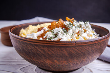 banosh, polenta with cracklings and brynza in a clay bowl