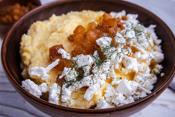 banosh, polenta with cracklings and brynza in a clay bowl