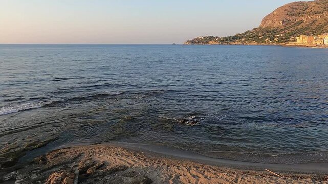 sunset at the beach in Aspra, Sicily. Italy