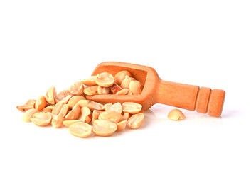 Roasted peanuts in the wood scoop isolated on white