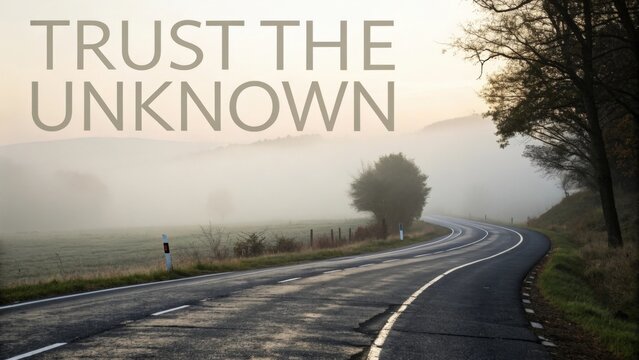 Empty road curving into fog with motivational text