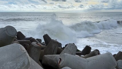 Ocean Waves Crashing on Tetrapod Breakwaters - A Coastal Defense. - Powered by Adobe