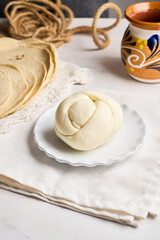 Traditional oaxaca cheese ball or quesillo. Mexican food.