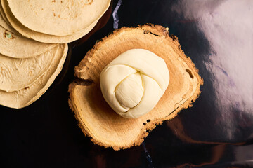 Traditional oaxaca cheese ball or quesillo. Mexican food.