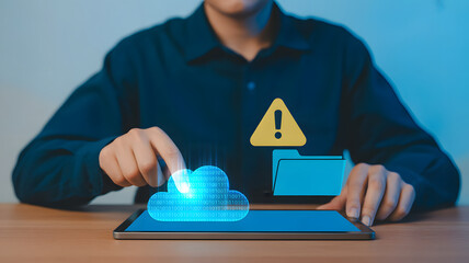 Person interacting with digital cloud data on tablet, warning symbol, and file folder, representing cybersecurity and data management solutions.