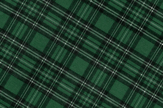 Christmas Tartan Plaid Seamless Design Checkered plaid. Cloth Pattern background of Scottish style. New year textile decorations. green Black top view. empty tablecloth table cloth diagonal texture