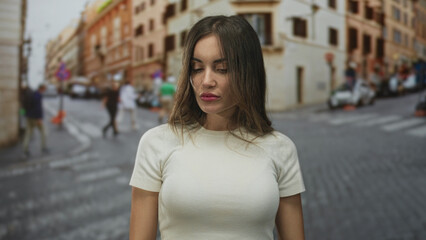Fototapeta premium Hispanic young woman raises hands in shrug gesture on bustling city street amid passing traffic; uncertainty.