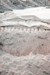 Detailed view of wavy sand surface showing fine grains, wind marks, and natural desert textures.