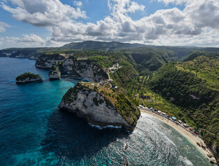stormy coast with sunlight shining, rugged coastal headlands against stormy clouds and bright Diamond Beach Nusa Penida Bali 