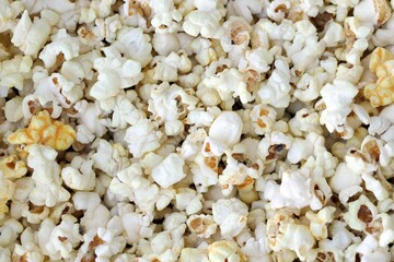 Homemade Salty Popcorn, top view. Flat lay overhead from above.