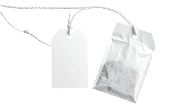 A close-up shot of two white tea bag components, one empty and tagged, the other full
