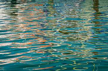 Reflections on the water created of boats