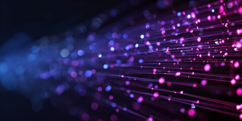 Glowing digital light streams move forward with scattered luminous points against a dark background.