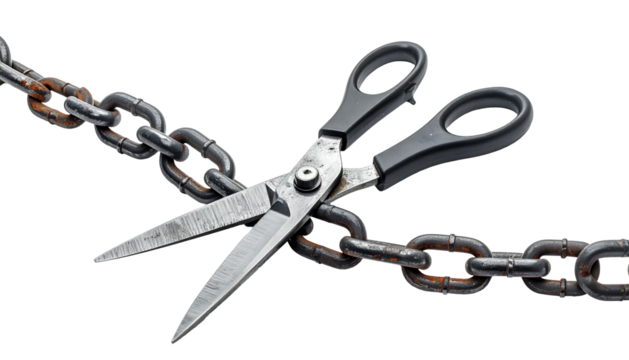 A pair of scissors cutting a rusty metal chain against a black background
