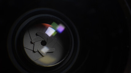Camera lens aperture on a black background.