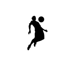 Silhouette of a soccer player jumping to head the ball during a game