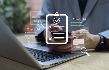 Business professional completing checklist and digital survey form for task management and productivity tracking. Concept of performance evaluation, workflow management, and operational efficiency.