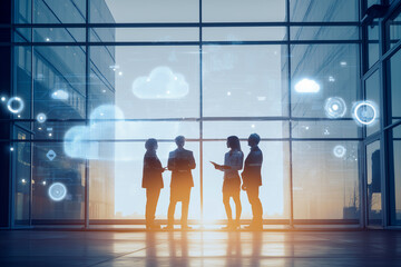Business team discussing digital strategy with cloud computing icons, modern office, technology innovation, and data analysis at sunset