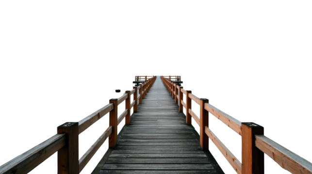 Wooden pier with handrails extending towards the horizon, framed by the bright sky, evoking a sense of tranquility and an invitation to embark on a journey.