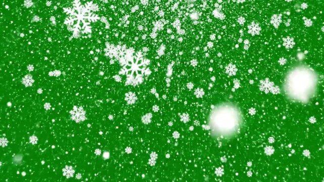 Beautiful Falling Snowflakes Floating Gently Against a Green Screen Background Creating a Soft Winter Atmosphere for Holiday Chroma Key Video Effects and Animation