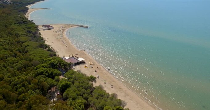 Aerial view of the beach of Eraclea Minoa, located in the province of Agrigento, Sicily, Italy. It's a long sandy beach overlooking the Mediterranean Sea. The sea's colors range from blue to turquoise