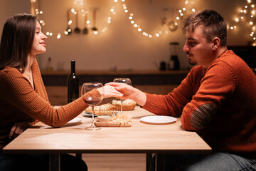 Couple in love Romantic date at night at home. couple celebrating Valentine's day.