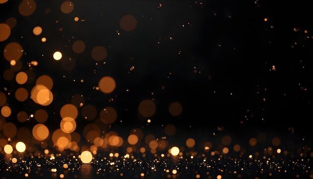 Vibrant golden bokeh lights sparkle against a deep black background.