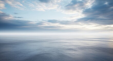 Calm Blue Water Rippling Under Cloudy Pale Sky at Sunset