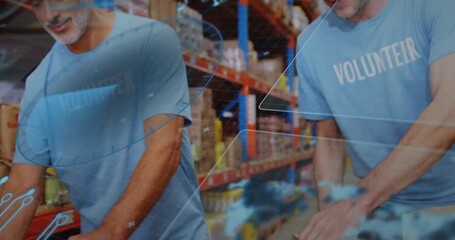 Hands arranging groceries initiating pullback, two volunteers packing while HUD aiding food packing - Powered by Adobe