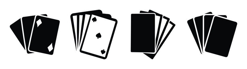 Four sets of playing cards spanning across a white surface