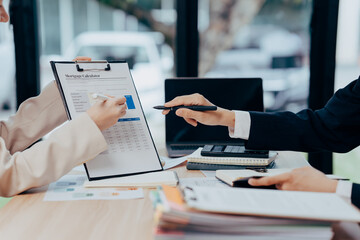 Business Meeting: Professionals collaboratively analyze financial reports, sharing insights and expertise amidst a backdrop of strategic decision-making.