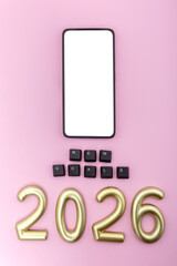 Smartphone with number 2026 and black keys on pink background. Concept of planning new digital goals and future motivation. Vertical photo, mock-up